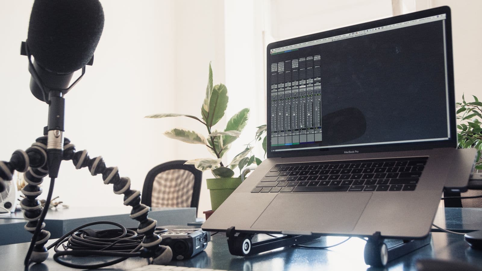 A microphone next to a laptop