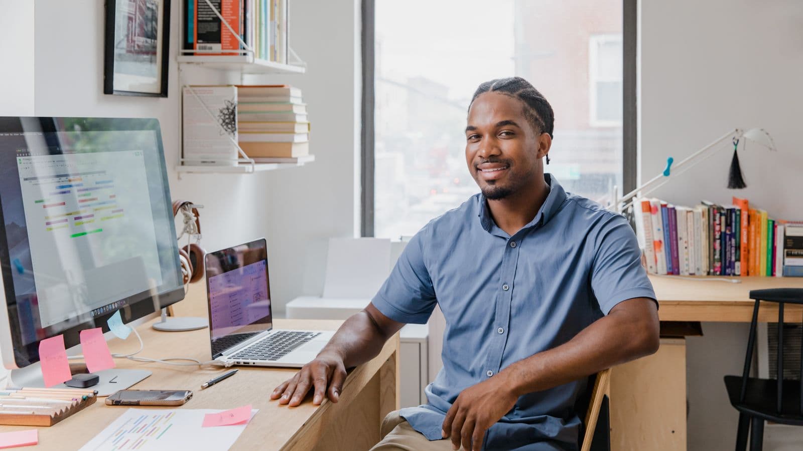 A person working at a laptop at their desk